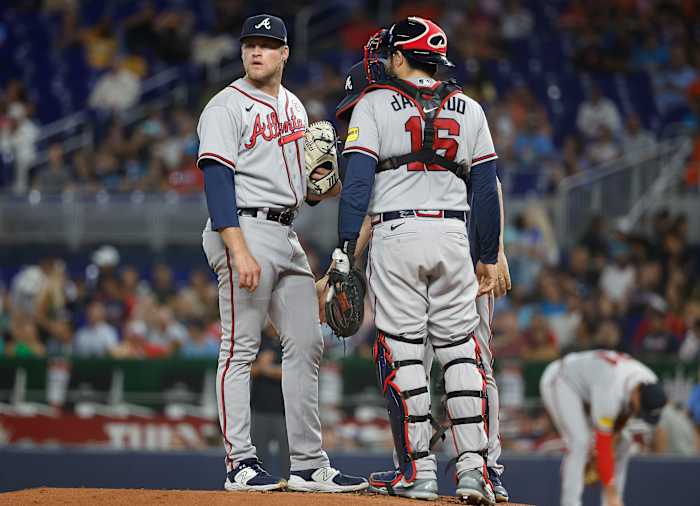 Sep 15, 2023; Miami, Florida, USA; Atlanta Braves starting pitcher Bryce Elder (55) and catcher Travis d'Arnaud (16) stand on the mound between batters against the Miami Marlins during the first inning at loanDepot Park.